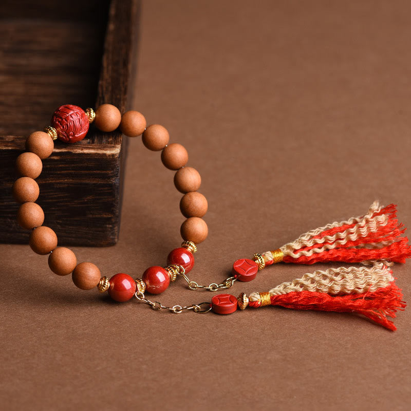 Braccialetto con nappe di ricchezza in legno di pesca naturale tibetano di cinabro PiXiu Buddha Stones