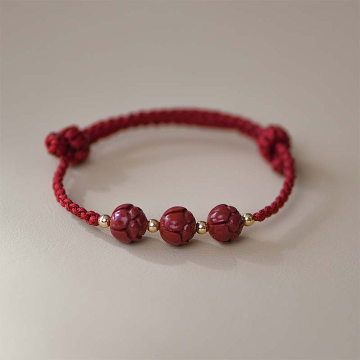 Braccialetto intrecciato con corda rossa calma, giada, cinabro e loto Buddha Stones
