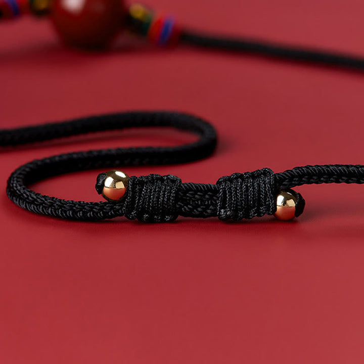 Collana con ciondolo in corda di benedizione con perline di cinabro e Buddha Stones