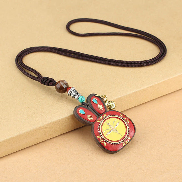 Collana pendente Thangka con cinque divinità della ricchezza in ebano tibetano