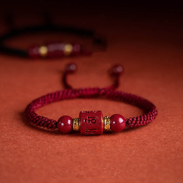 Buddha Stones Tibet Cinabro Om Mani Padme Hum Braccialetto intrecciato con benedizione inciso