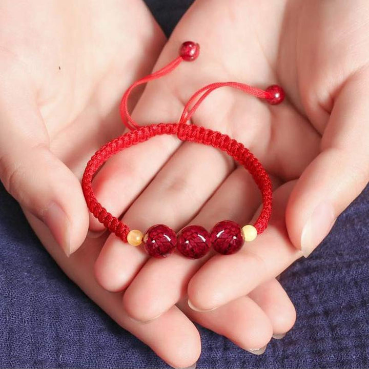 Braccialetto rosso con corda e cinabro per bambini, con Buddha Stones