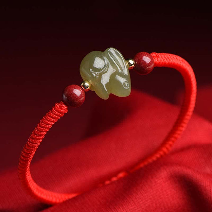 Braccialetto di corda dell'abbondanza di perline di cinabro con coniglietto di giada di Hetian dell'anno del coniglio