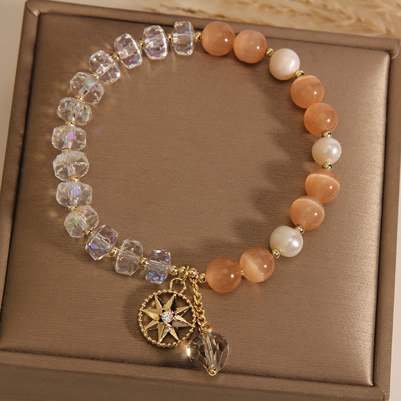 Braccialetto di supporto con stella di cristallo bianco e occhio di gatto arancione Buddha Stones
