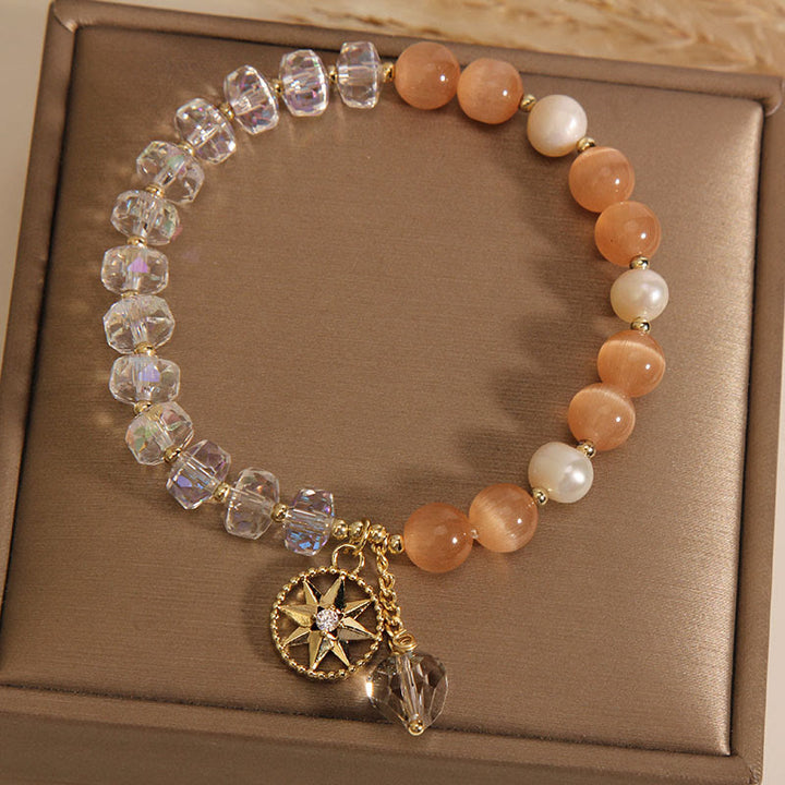 Braccialetto di supporto con stella di cristallo bianco e occhio di gatto arancione Buddha Stones