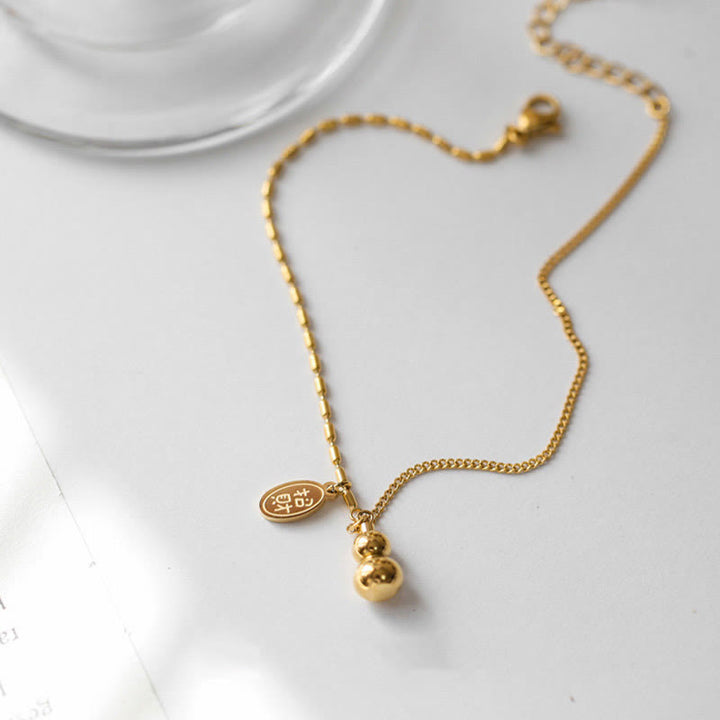 Cavigliera con fibbia della ricchezza e design a zucca portafortuna in oro 18k Buddha Stones