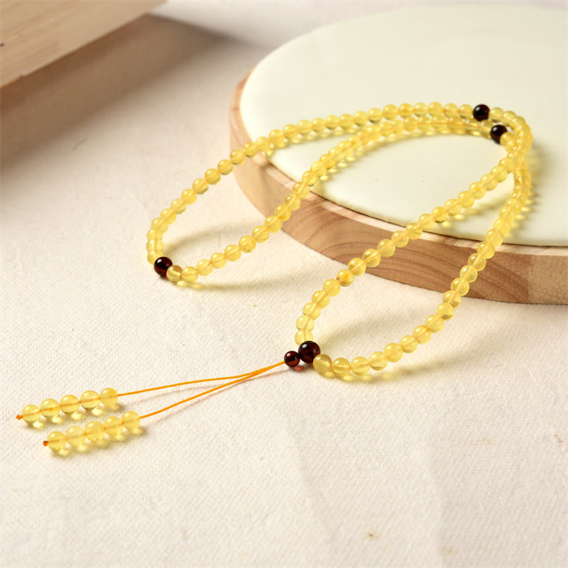 Braccialetto anti-ansia con 108 perline di mala in ambra naturale e trasparente Buddha Stones