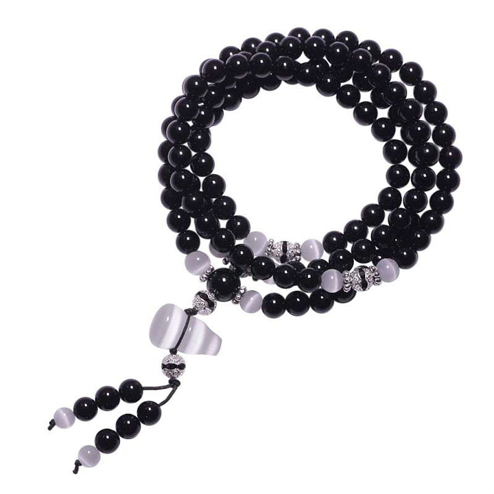 Braccialetto di meditazione con perline di cristallo bianco e onice nero Buddha Stones