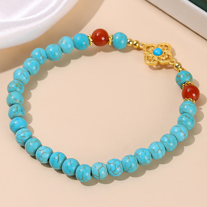 Braccialetto di protezione dell'equilibrio con perline turchesi Buddha Stones