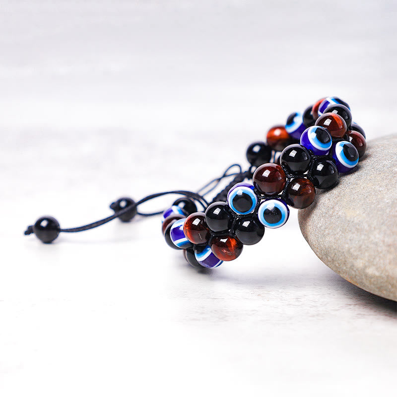 Braccialetto di perline di protezione dell'occhio di tigre con ematite e Buddha Stones