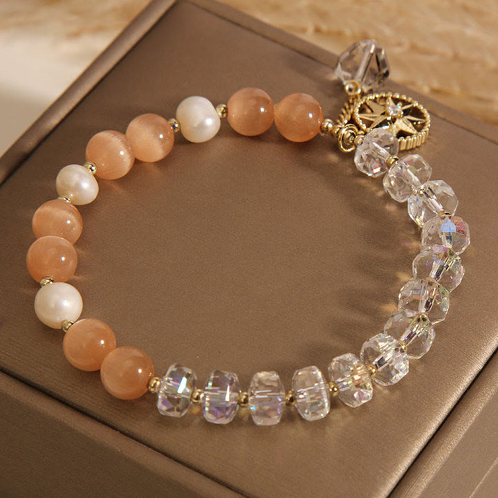 Braccialetto di supporto con stella di cristallo bianco e occhio di gatto arancione Buddha Stones