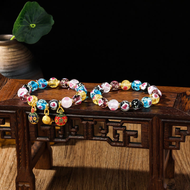 Braccialetto di perline di vetro fluorescente luminoso Liuli con cuore rosa della famiglia di bestie che ingoiano Buddha Stones