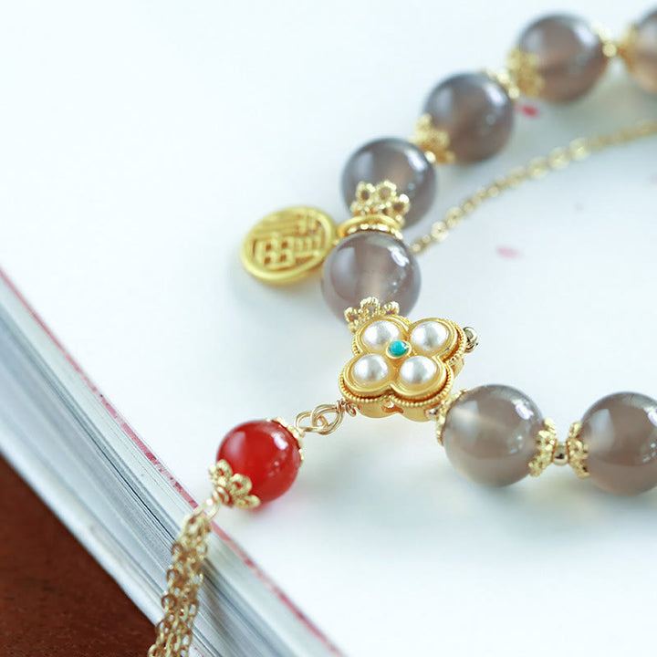 Braccialetto di equilibrio con nappa di perle di carattere Fu in agata grigia naturale Buddha Stones