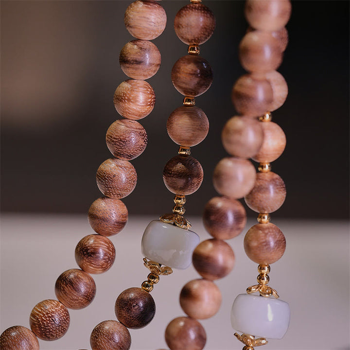 Braccialetto con ciondolo Ruyi in lingotto di giada ambrato naturale con Buddha Stones agarwood