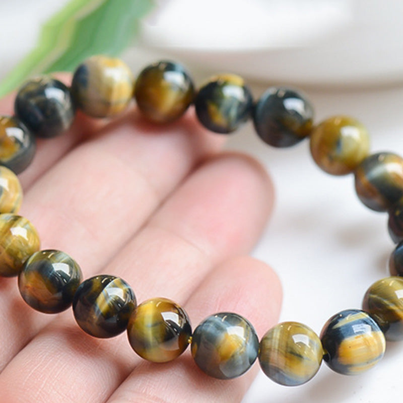 Braccialetto di protezione e forza con occhio di tigre Buddha Stones
