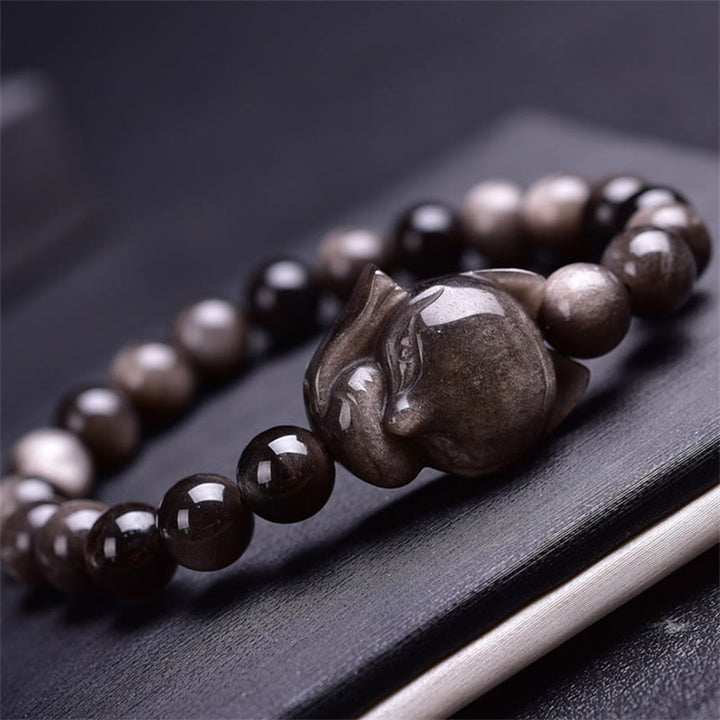 Braccialetto di protezione in ossidiana naturale con Buddha Stones argento lucido