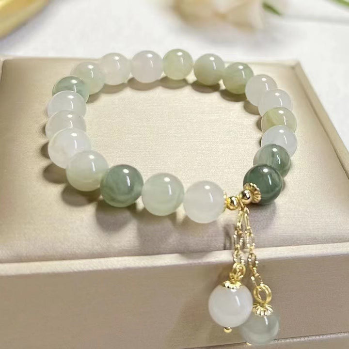 Braccialetto con ciondolo a forma di perlina di fortuna con abbondanza di giada sfumata naturale Buddha Stones