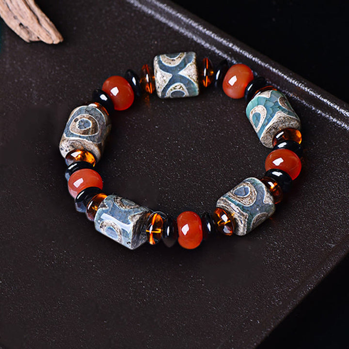 Braccialetto di protezione della felicità con perline Dzi a tre occhi tibetane Buddha Stones