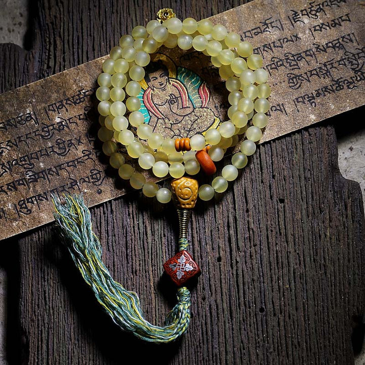 Braccialetto della fortuna in ambra e corno di pecora del Tibet con 108 perle di Mala Buddha Stones