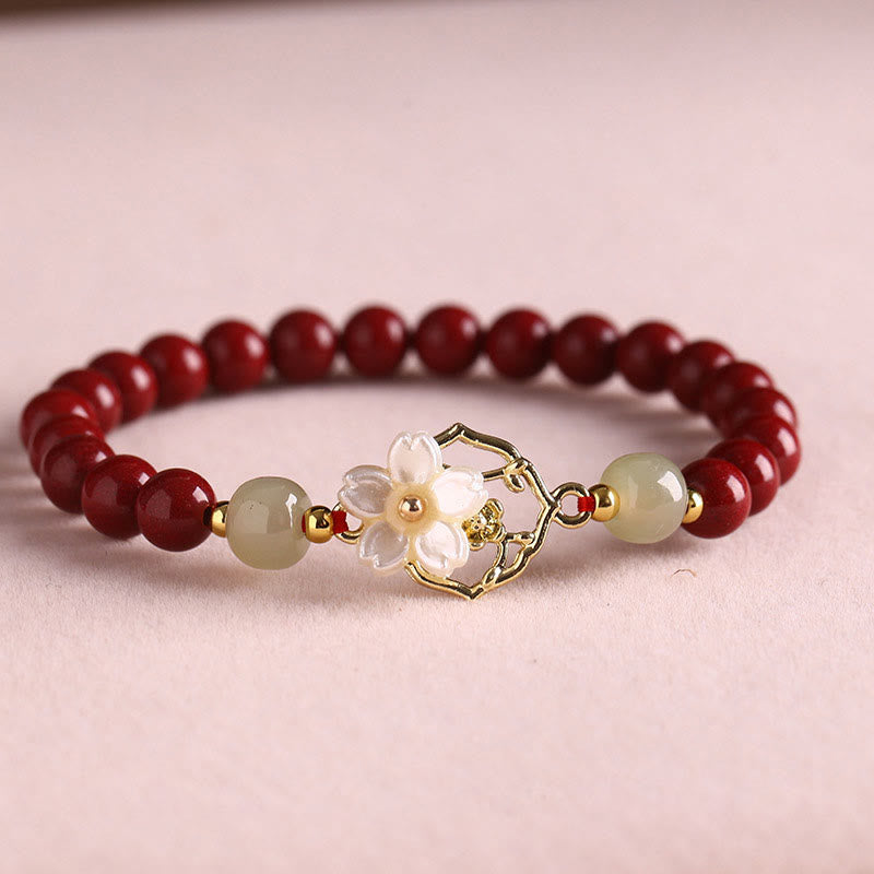 Braccialetto di benedizione con fiore di pietra di tridacna con perline di giada naturale di cinabro Buddha Stones