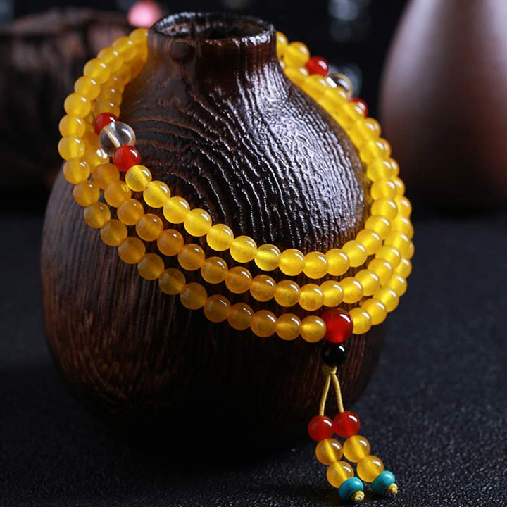 Braccialetto dell'armonia Buddha Stones 108 Mala Beads in calcedonio giallo