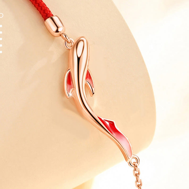 Braccialetto in corda rossa intrecciata con stella di loto e pesce koi in argento sterling 925 Buddha Stones