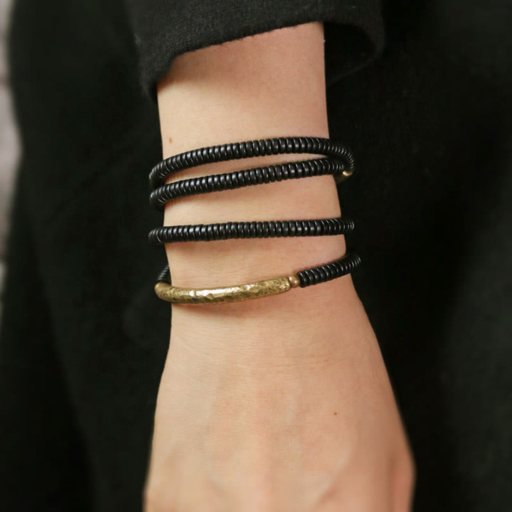 Bracciale multistrato in legno di ebano e rame Buddha Stones Balance