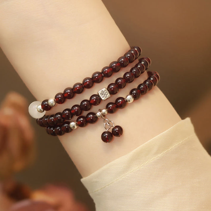 Braccialetto triplo giro Buddha Stones in argento sterling 925 con granato naturale e protezione per gli occhi di gatto