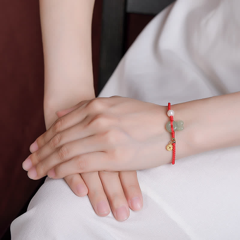Braccialetto in corda rossa con moneta di rame e giada di Hetian dell'anno del coniglio in argento sterling 925