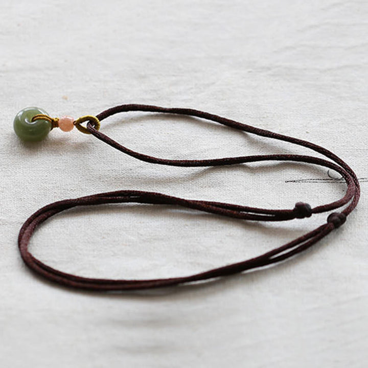 Collana con ciondolo in corda con fibbia della pace in giada rotonda naturale Buddha Stones Lotus Abundance - image 12