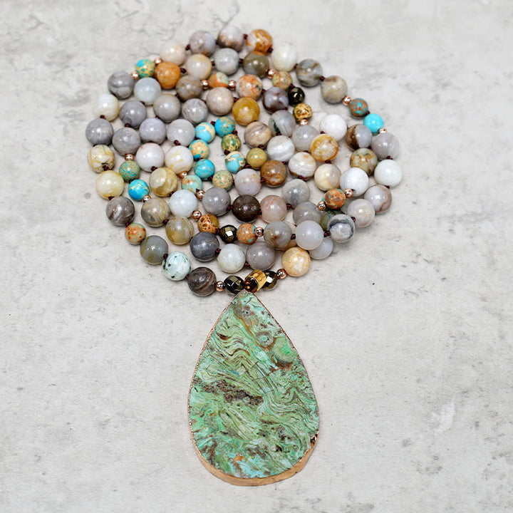 Collana di perline di guarigione in diaspro Picasso naturale dell'oceano Buddha Stones