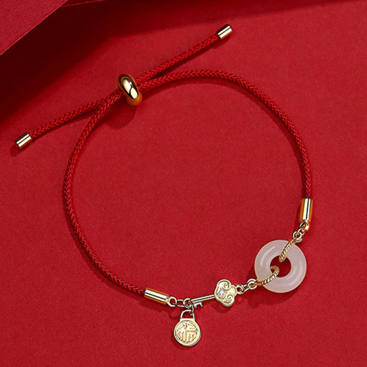 Braccialetto in corda rossa con fibbia della pace in giada Hetian placcato oro 18K con carattere Fu e Buddha Stones
