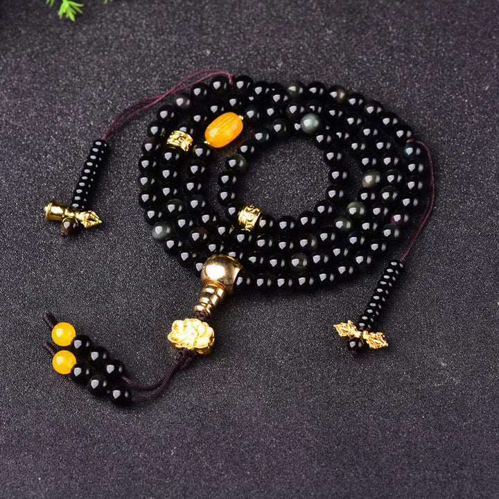 Braccialetto Mala Buddha Stones 108 perle in ossidiana nera naturale Lotus Fulfilment