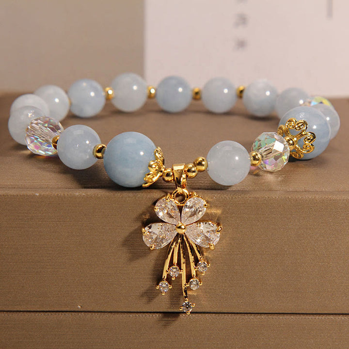 Braccialetto con ciondolo a farfalla in zircone con cristalli rosa e acquamarina Buddha Stones