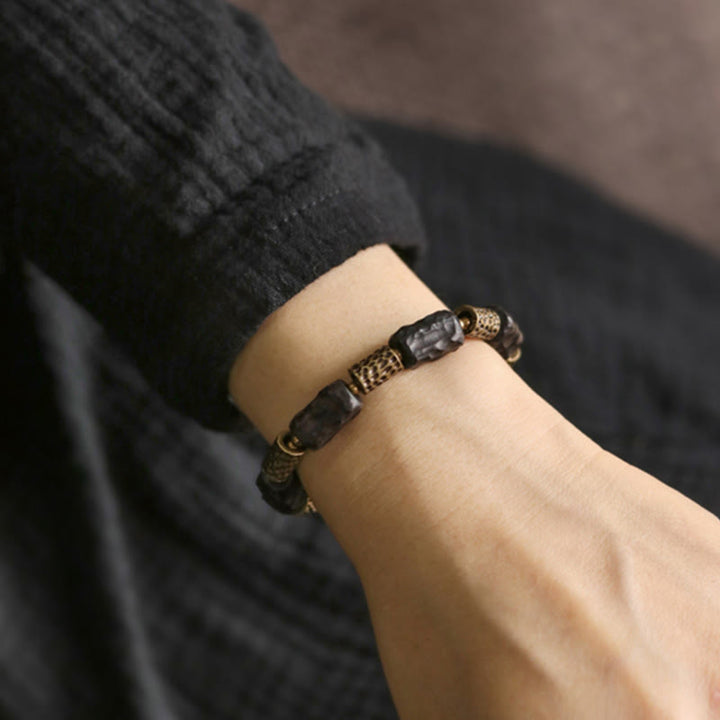Braccialetto Buddha Stones Tibetano Ebano Legno Rame Calma Pace