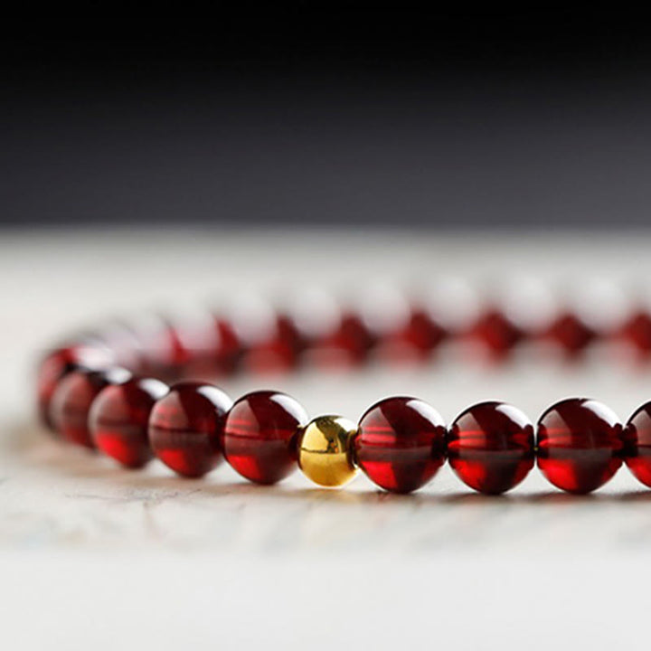 Braccialetto di protezione in granato naturale con pesce koi in oro 999 Buddha Stones