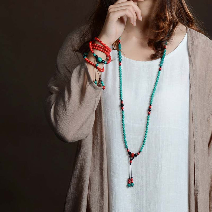 Braccialetto di protezione con perline di turchese rosso e onice nero Buddha Stones