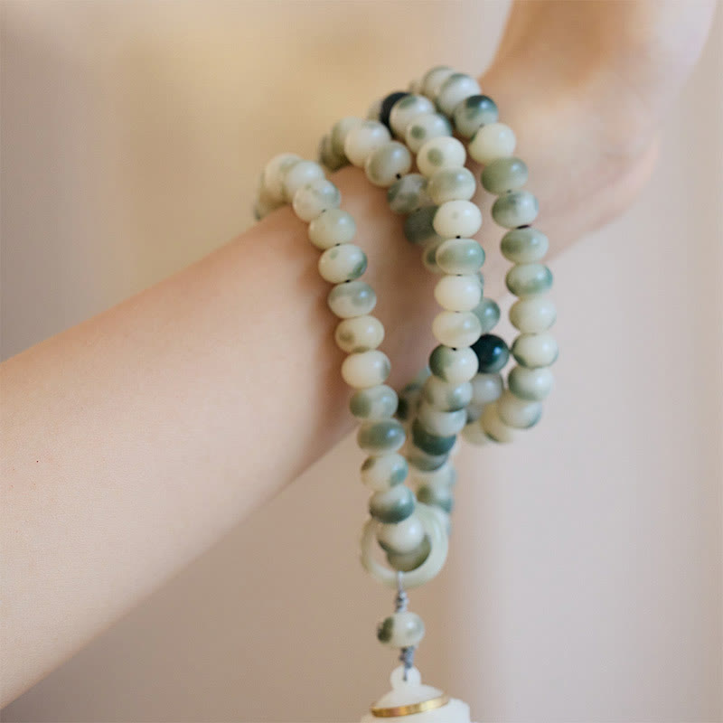 Buddha Stones naturali 108 perle Mala Bodhi Seed Lotus inciso braccialetto di saggezza nappa