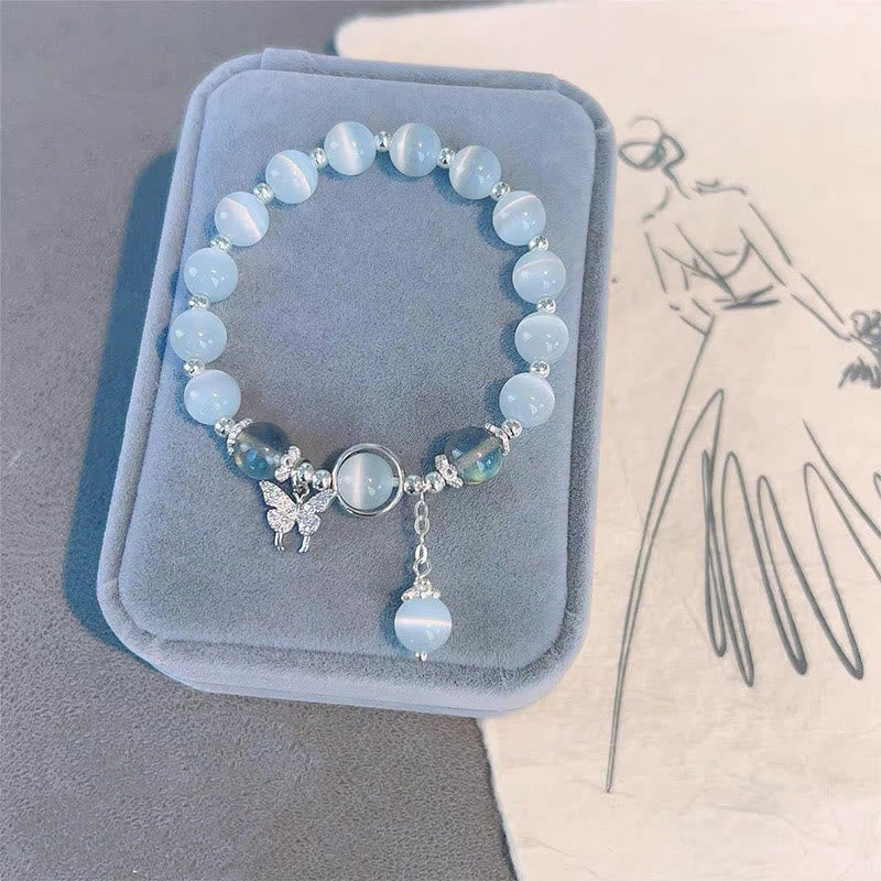 Braccialetto di supporto con ciondolo a forma di stella a forma di farfalla, pietra di luna e occhio di gatto Buddha Stones