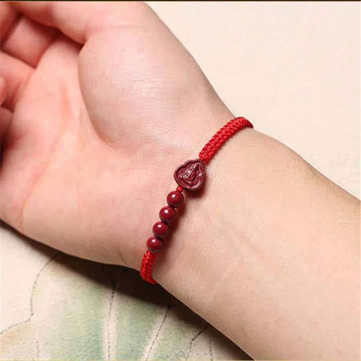 Bracciale con cordino di benedizione Buddha Stones che ride Buddha Avalokitesvara cinabro