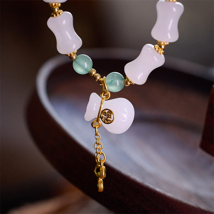 Buddha Stones Braccialetto di giada di seta dorata bianca naturale con motivo di bambù, borsa portafortuna Fu