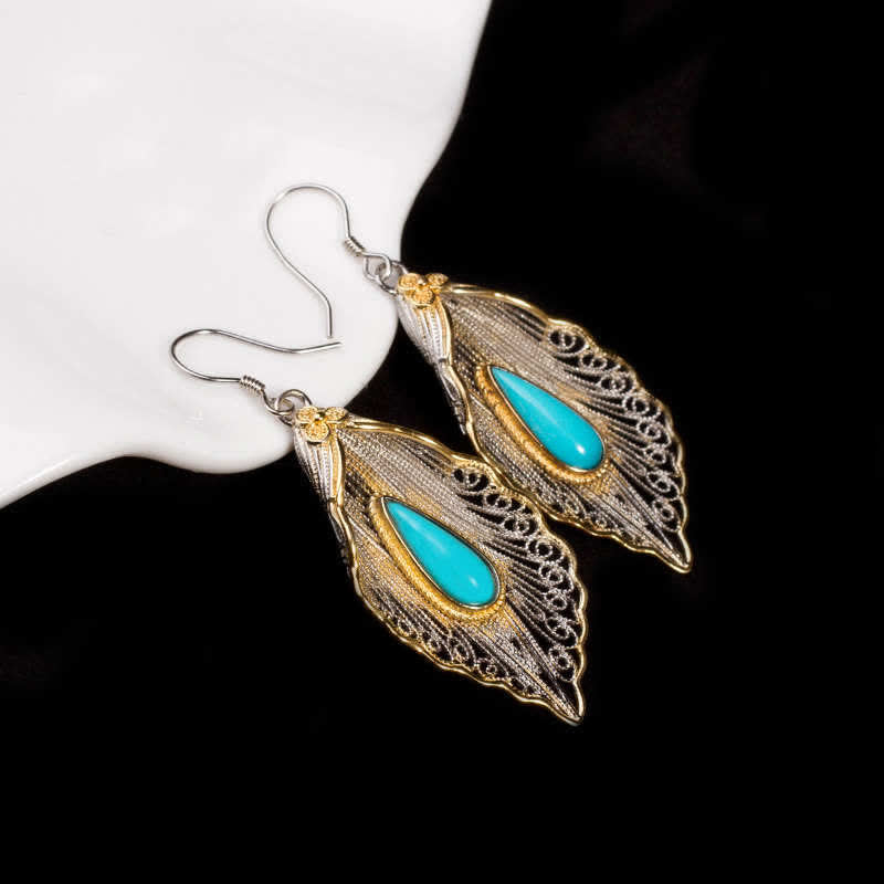 Orecchini pendenti con motivo a foglia di Bodhi in argento sterling 925 con Buddha Stones e turchese