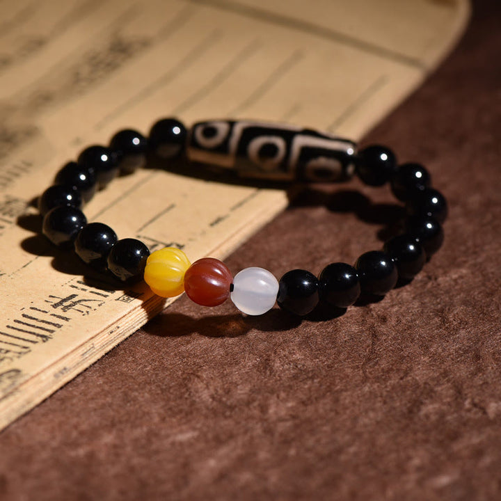 Braccialetto di potere della ricchezza con perline Dzi a nove occhi naturali tibetane Buddha Stones