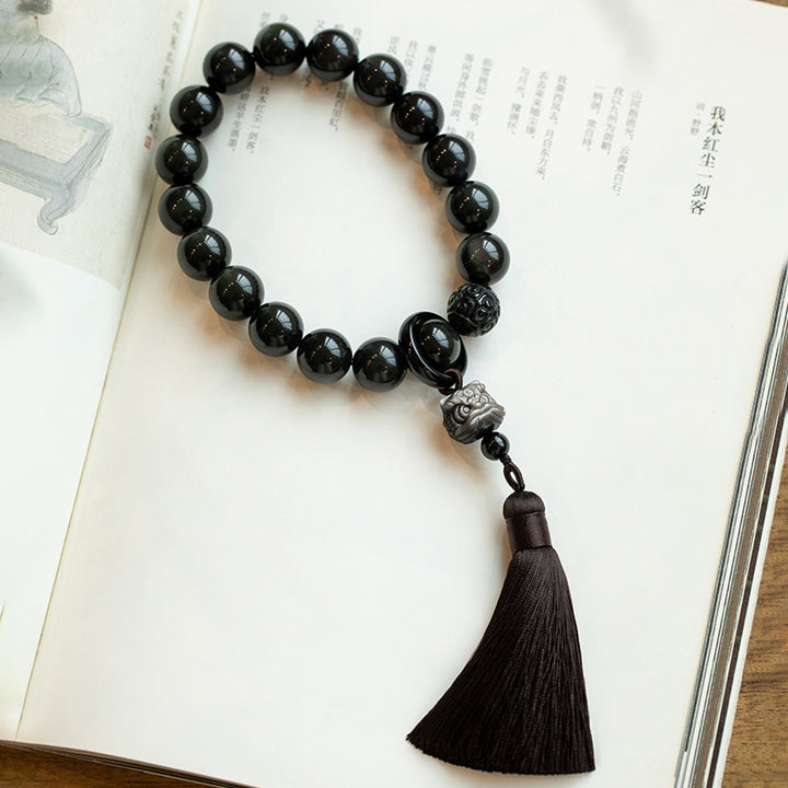Buddha Stones Argento naturale Ossidiana lucida Ossidiana nera Leone Mala da polso Protezione Nappe Mala tascabile Decorazione per auto