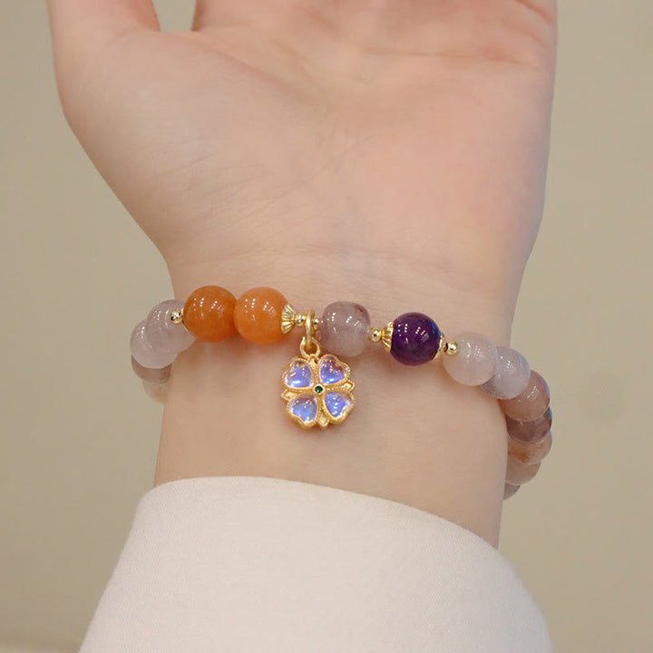 Braccialetto di perline con ciondolo a forma di fiore viola dorato naturale di seta Buddha Stones