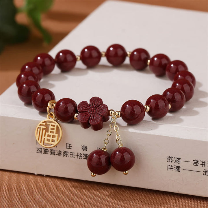Braccialetto di benedizione con fiori di ciliegio e carattere Fu in pietra di cinabro Buddha Stones