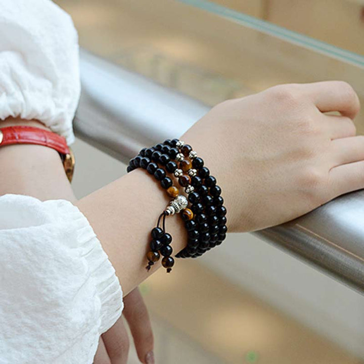 Bracciale Mala di benedizione con occhio di tigre e ossidiana nera Buddha Stones