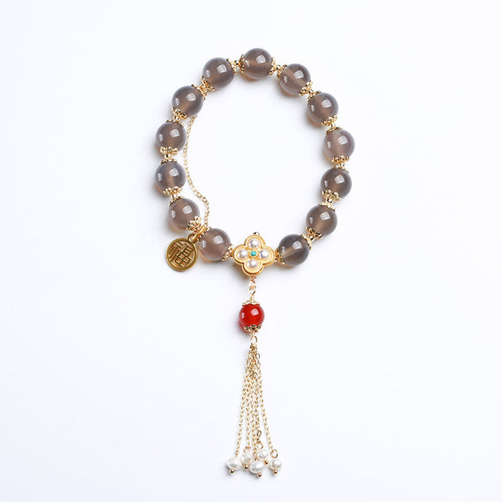 Braccialetto di equilibrio con nappa di perle di carattere Fu in agata grigia naturale Buddha Stones
