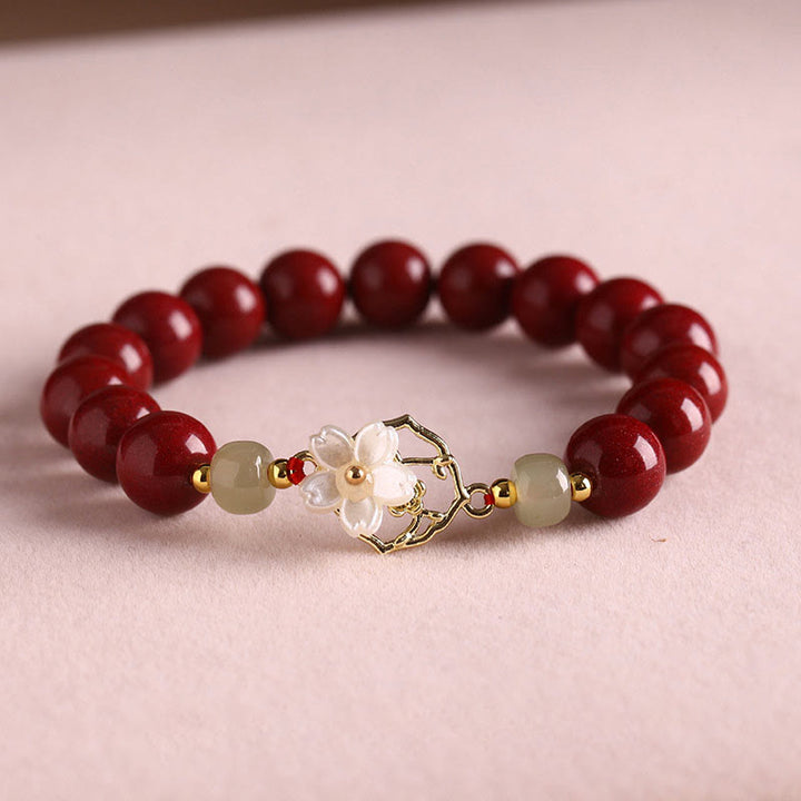 Braccialetto di benedizione con fiore di pietra di tridacna con perline di giada naturale di cinabro Buddha Stones