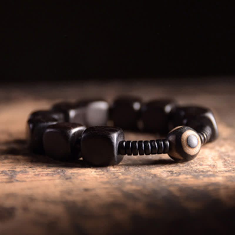 Braccialetto di forza con perline di legno di ebano tibetano Dzi Buddha Stones